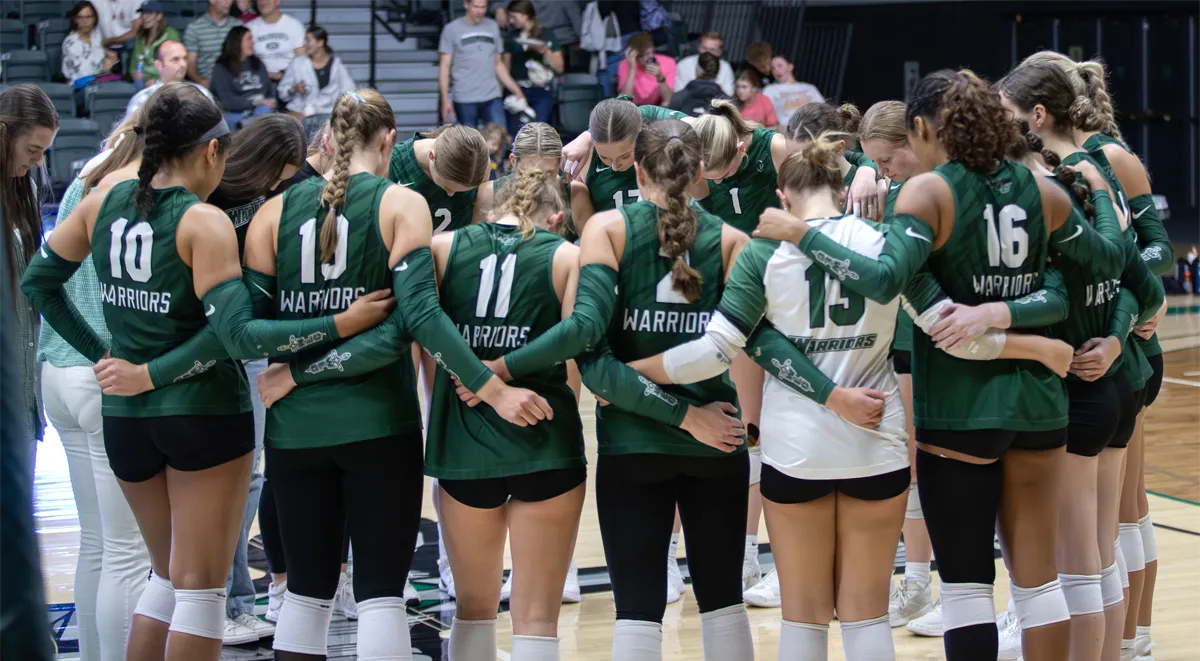 WLC Volleyball team huddle